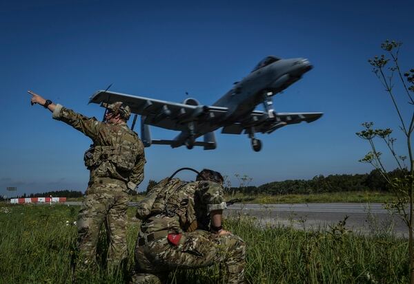 Combat controllers with the 321st Special Tactics Squdron guide an A-10 Thunderbolt II pilot for a landing on the Jägala-Käravete Highway in Estonia. (Senior Airman Ryan Conroy/Air Force)