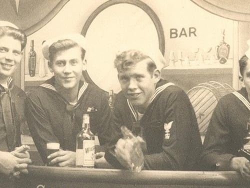 Sailors from the destroyer escort Rinehart drinking faux booze in a staged souvenir photo at Radio City Music Hall during World War II. The bottles were empty. And that's not because they were using the grain alcohol to make hand sanitizer. Don't do that. (a gift from William Schultz, now in the collections of U.S. Naval History and Heritage Command)