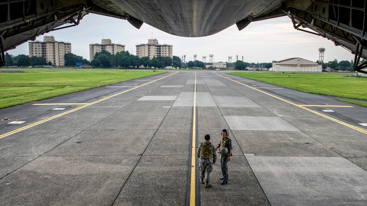 On the ground at Yokota Air Base, the Air Force transport hub of the Pacific
