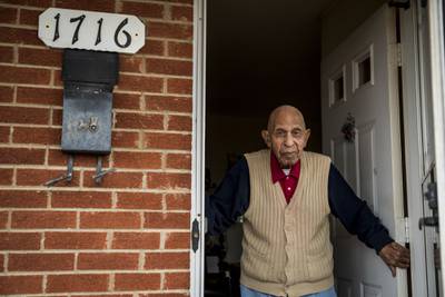 In this Dec. 9, 2020, file photo, Alfred Farrar, a Tuskegee Airman, poses for a portrait in the doorway of his home in Lynchburg, Va.