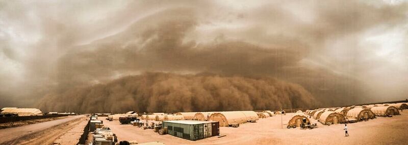 A sand storm moves in at Nigerien Air Base 201, Niger, in June. Dust storms are just some of the weather complications that make construction in the Sahara difficult. (Airman 1st Class Thomas Jamison/Air Force)