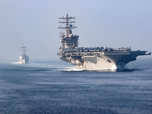 The aircraft carrier USS Nimitz (CVN 68), guided-missile destroyer USS John Paul Jones (DDG 53), center, and the guided-missile cruiser USS Princeton (CG 59) sail in formation during a scheduled transit of the Strait of Hormuz, Nov. 9, 2020. (MC3 Anthony Collier/Navy)