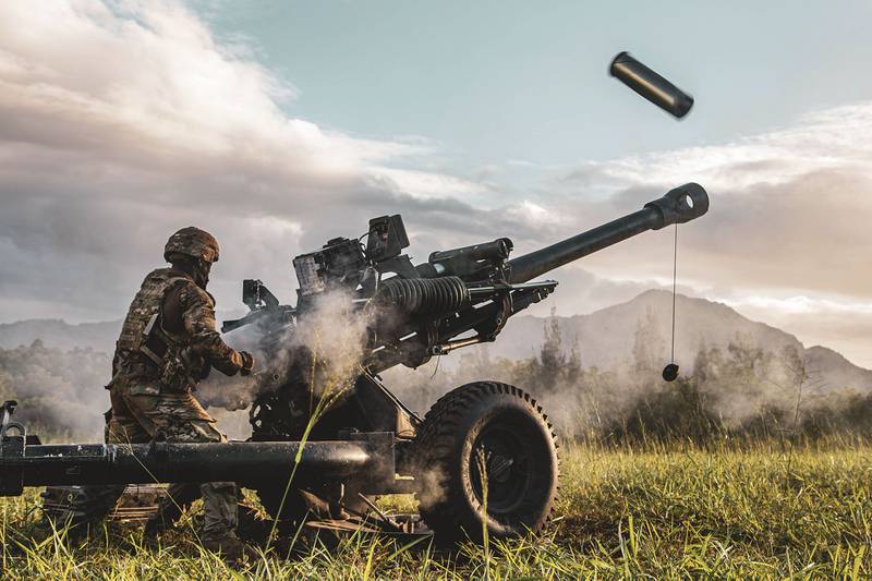 Service members participate in an exercise called Operation Wardog Kila for a joint live-fire exercise at Schofield Barracks, Hawaii, Dec. 30, 2020, with the 25th Combat Aviation Brigade, 25th Infantry Division Artillery units and the U.S. Marine Corps.