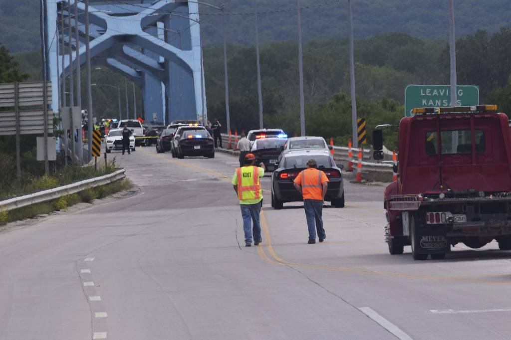 Authorities gather on Centennial Bridge after a shooting Wednesday, May 27, 2020, near Leavenworth, Kan.