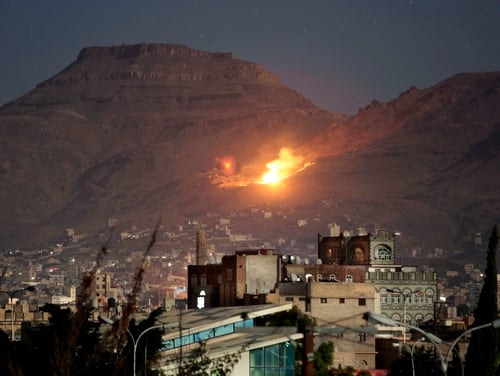 Fire and smoke rise after a Saudi-led airstrike hit a site believed to be one of the largest weapons depots on the outskirts of Yemen's capital, Sanaa, in October 2016. The Pentagon earlier this year initiated an operation to support Saudi Arabia and other partner nations operating in Yemen. (Hani Mohammed/Associated Press)