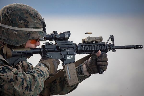 A Marine with Battalion Landing Team, 1st Battalion, 2nd Marine Regiment, 22nd Marine Expeditionary Unit, fires his M4 carbine at targets as part of a live-fire deck shoot (Cpl. Aaron Henson/Marine Corps)