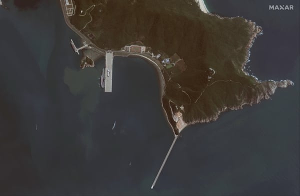 This satellite image collected Nov. 19 via the WorldView-1 satellite shows China’s first domestically built aircraft carrier shortly after arriving in port near the Yulin Naval Base on Hainan island, China. The carrier has been referred to as Type-001A. It was sailing through the Taiwan Strait on Nov. 17. Seven Shenyang J-15 fighter aircraft can be seen on the deck of the carrier along with several helicopters, their blades stowed in a travel position. (Maxar Technologies)