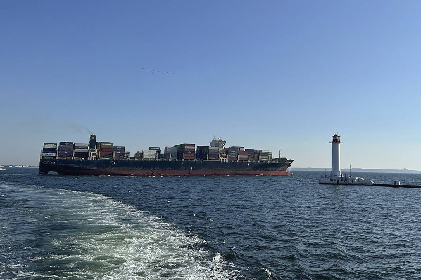 In this photo provided by Ukraine's Infrastructure Ministry Press Office, container ship Joseph Schulte (Hong Kong flag) leaves the port of Odesa to proceed through the temporary corridor established for merchant vessels from Ukraine's Black Sea ports in Odesa, Ukraine, Wednesday, Aug. 16, 2023.