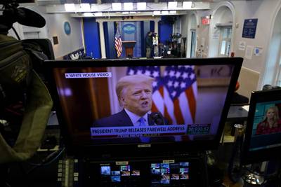 President Trump is seen on a network monitor after his pre-recorded farewell speech was released, inside the Brady Press Briefing Room at the White House, Tuesday, Jan. 19, 2021, in Washington.