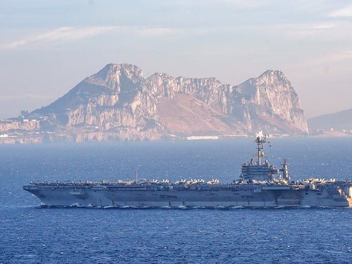 The aircraft carrier Harry S. Truman transits the Straits of Gibralter, leaving the Mediterranean on June 28, heading into the Atlantic Ocean. The Truman and three escorts are now heading home from Norfolk after only three months deployed. (photo by MC2 Thomas Gooley/Navy)