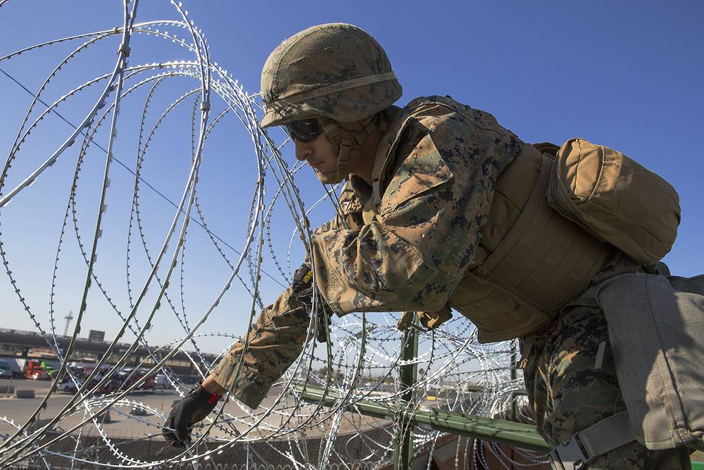 Razor wire is most visible result of 210M troop deployment to the US