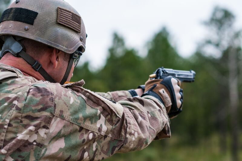 Master Sgt. Russell Moore, with the 416th Theater Engineer Command and a member of the U.S. Army Reserve Marksmanship Team, engages targets with his M9 pistol during the Dot Torture event on the final day of the U.S. Army Forces Command Weapons Marksmanship Competition Sept. 23, 2015, at Fort Bragg, N.C. The three-day FORSCOM competition features 27 marksmen from the U.S. Army, U.S. Army Reserve and the National Guard in events for the M9 pistol, the M4A1 rifle and the M249 SAW, or Squad Automatic Weapon, to recognize Soldiers who are beyond expert marksmen. The multi-tiered events challenge the competitors' ability to accurately and quickly engage targets in a variety of conditions and environments. (U.S. Army photo by Timothy L. Hale/Released)