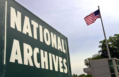 A sign stands at the entrance to the National Archives building May 6, 2002, in College Park, Md.