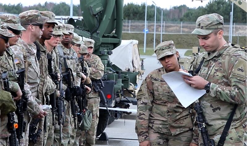 Soldiers with 1st Battalion, 35th Armor Regiment, 2nd Armored Brigade Combat Team, 1st Armored Division from Fort Bliss, Texas, check in for roll call after arriving at Drawsko Pomorskie Training Area, Poland, on March 19, 2019. (Sgt. Thomas Calvert/Army)