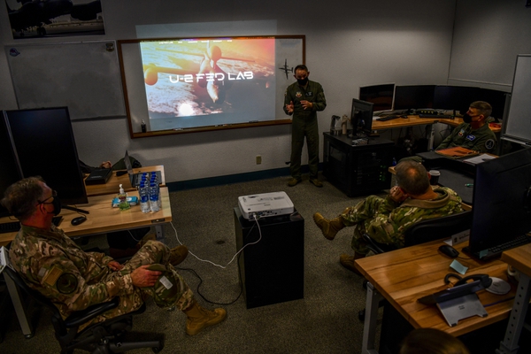 Gen. Mark Kelly, right, commander of Air Combat Command, and Command Chief Master Sgt. David Wade of ACC receive a briefing from U-2 Federal Laboratory staff about the organization’s stand-up and recent projects, Dec. 4, 2020, at Beale Air Force Base, Calif. (Staff Sgt. Colville McFee/U.S. Air Force)