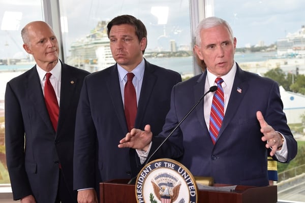 Vice President Mike Pence, right, along with Florida Sen. Rick Scott, left, and Gov. Ron DeSantis, center, speaks to the media after a meeting with cruise line company leaders to discuss the efforts to fight the spread of the COVID-19 coronavirus, at Port Everglades, Saturday in Fort Lauderdale, Fla. (Gaston De Cardenas/AP)