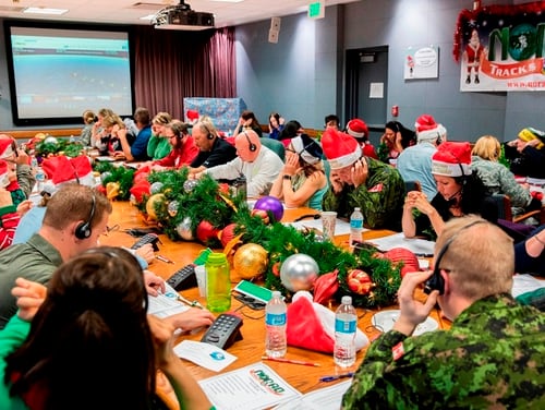 Military and civilian volunteers join North American Aerospace Defense Command's Santa-tracking efforts at Peterson Air Force Base, Colorado, in 2016 (Dennis Carlyle/Air Force)