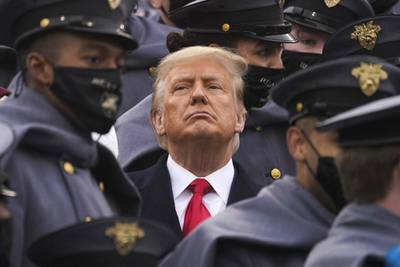 Surrounded by Army cadets, President Donald Trump watches the first half of the 121st Army-Navy Football Game in Michie Stadium at the United States Military Academy, Saturday, Dec. 12, 2020, in West Point, N.Y.