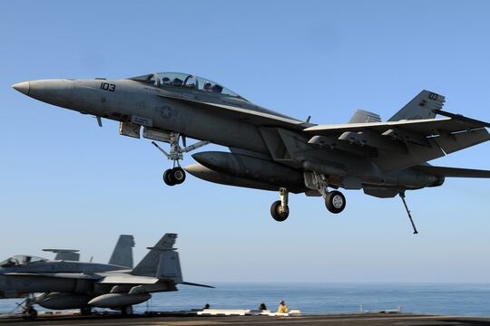 An F/A-18F Super Hornet assigned to the Bounty Hunters of Strike Fighter Squadron (VFA) 2 prepares to land on the flight deck of the Nimitz-class aircraft carrier USS Abraham Lincoln (CVN 72). (U.S. Navy photo by Mass Communication Specialist Seaman Joshua E. Walters)