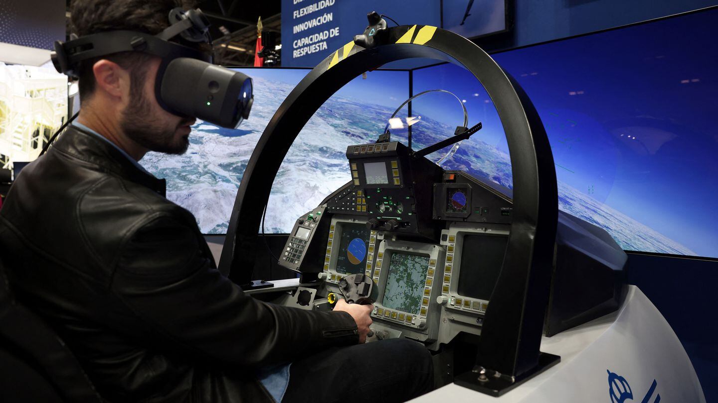 An attendee of FEINDEF pilots a flight simulator on May 17, 2023. (Thomas Coex/AFP via Getty Images)