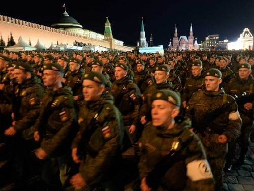 Russian soldiers march in a Victory Day military parade last year in Moscow. Russia is now massing troops and equipment for what Kremlin officials say will be the country's largest military exercise in four decades. (Vasily Maximov/AFP/Getty Images)