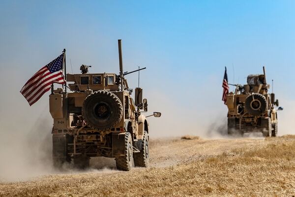 A U.S. military convoy takes part in joint patrol with Turkish troops in the Syrian village of al-Hashisha on the outskirts of Tal Abyad town along the border with Turkish troops, on Sept. 8, 2019. (Delil Souleiman/AFP via Getty Images)