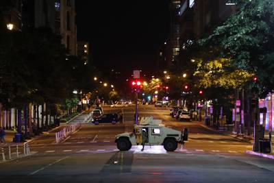A military Humvee blocks an intersection along K Street in downtown Washington as demonstrators protest the death of George Floyd, Monday, June 1, 2020, in Washington.