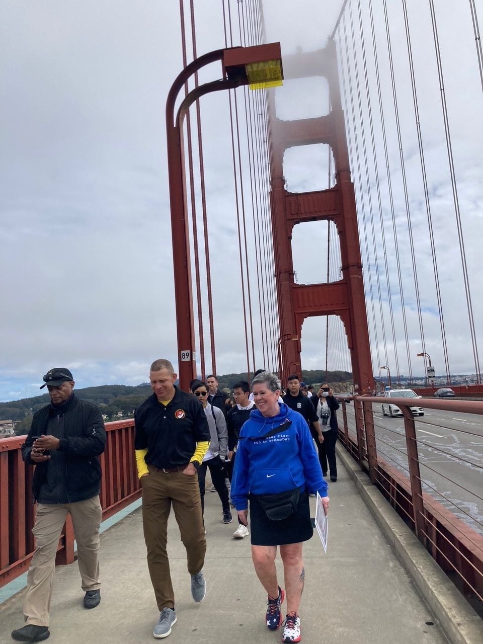 Sergeant Major of the Army Michael Grinston, left, talks with Gold Star mom Roxane Langevin, right, on San Francisco's Golden Gate Bridge, May 28, 2022, during Memorial Day weekend. (Meghann Myers/staff)