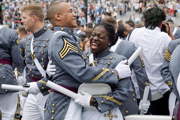 West Point cadets hug each other at the end of graduation ceremonies at the United States Military Academy, Saturday, May 25, 2019, in West Point, N.Y. (Julius Constantine Motal/AP)