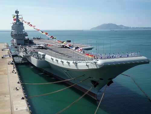 China's aircraft carrier Shandong is docked at a naval port in Sanya in southern China's Hainan Province on Dec. 17, 2019. New satellite imagery from late 2020 suggests Beijing is beefing up its naval support infrastructure in the area. (Li Gang/Xinhua via AP)