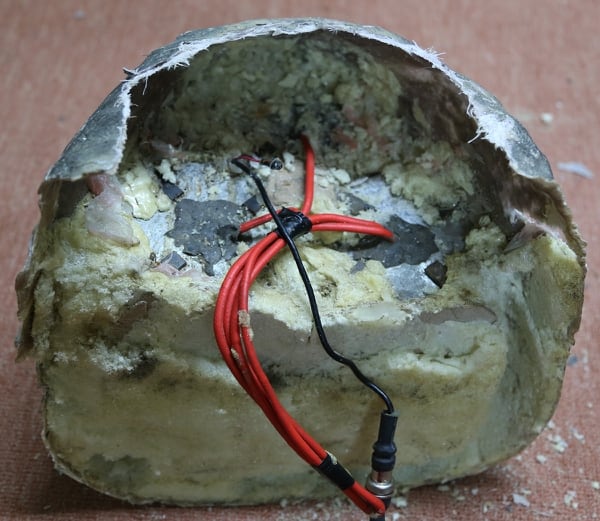 An explosive disguised as a rock is on display in Yemen. (Tim Michetti/Conflict Armament Research via AP)