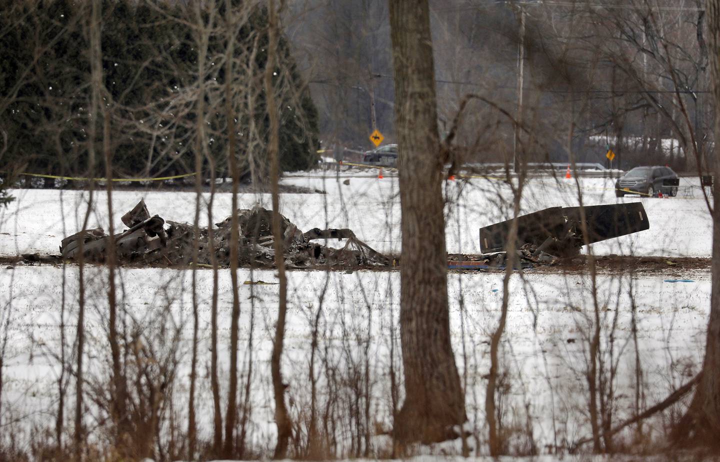 The wreckage of a UH-60 Black Hawk medical evacuation helicopter sits in a field in Mendon, NY., Thursday, Jan. 21, 2021.