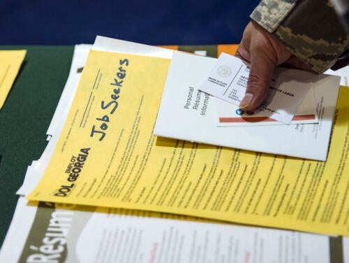 An airman grabs pamphlets during the veterans career fair on Oct. 19, 2017, at Moody Air Force Base in Georgia. (Airman Eugene Oliver/Air Force)