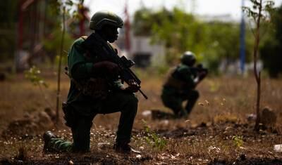 Ivorian Special Operations Forces pause to survey the terrain during training at the annual Flintlock exercise in Volta, Ghana, March 3, 2023.