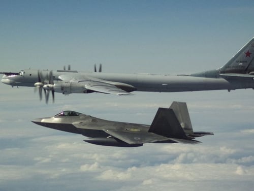 A Russian bomber is escorted by an F-22 off the west coast of Alaska on May 21. (NORAD)