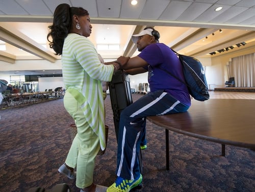 Ida Malone checks on her husband, Navy Chief Petty Officer Averill Malone, before a training camp for the 2015 DoD Warrior Games at Ventura County Naval Station Port Hueneme in Oxnard, Calif. June 3, 2015. (EJ Hersom/Defense Department)
