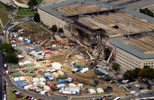 FBI agents, firefighters, rescue workers and engineers work at the Pentagon crash site on Sept. 14, 2001, where a hijacked American Airlines flight slammed into the building on Sept. 11. (Defense Department)
