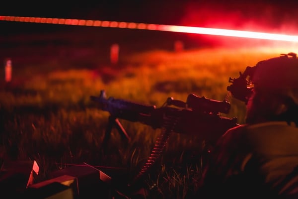 A Chile special forces soldier assists a U.S. SF soldier engage practice targets April 22, 2015, during night fire training in Camp Shelby, Miss., as part of a bilateral training exchange organized by members of Special Operations Command South. The training exchange promotes cooperation among peer nations as both countries share common concerns in the region regarding threats such as transnational organized crime and terrorism. (U.S. Army photo by Staff Sgt. Osvaldo Equite/Released)
