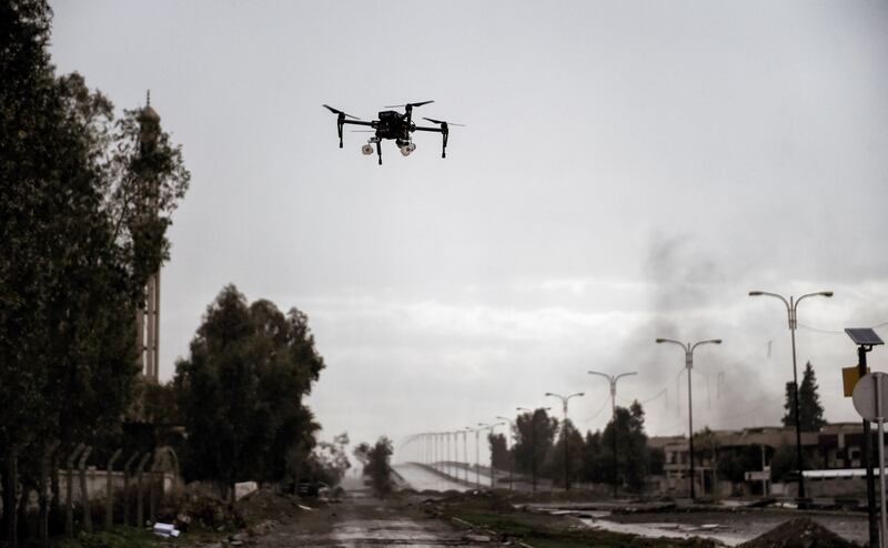 A picture taken on March 14, 2017, in the northern Iraqi city of Mosul shows a drone carrying two grenades flying in a test flight by Iraqi forces which aim to use it against Islamic State fighters. (Aris Messinis/AFP/Getty Images)