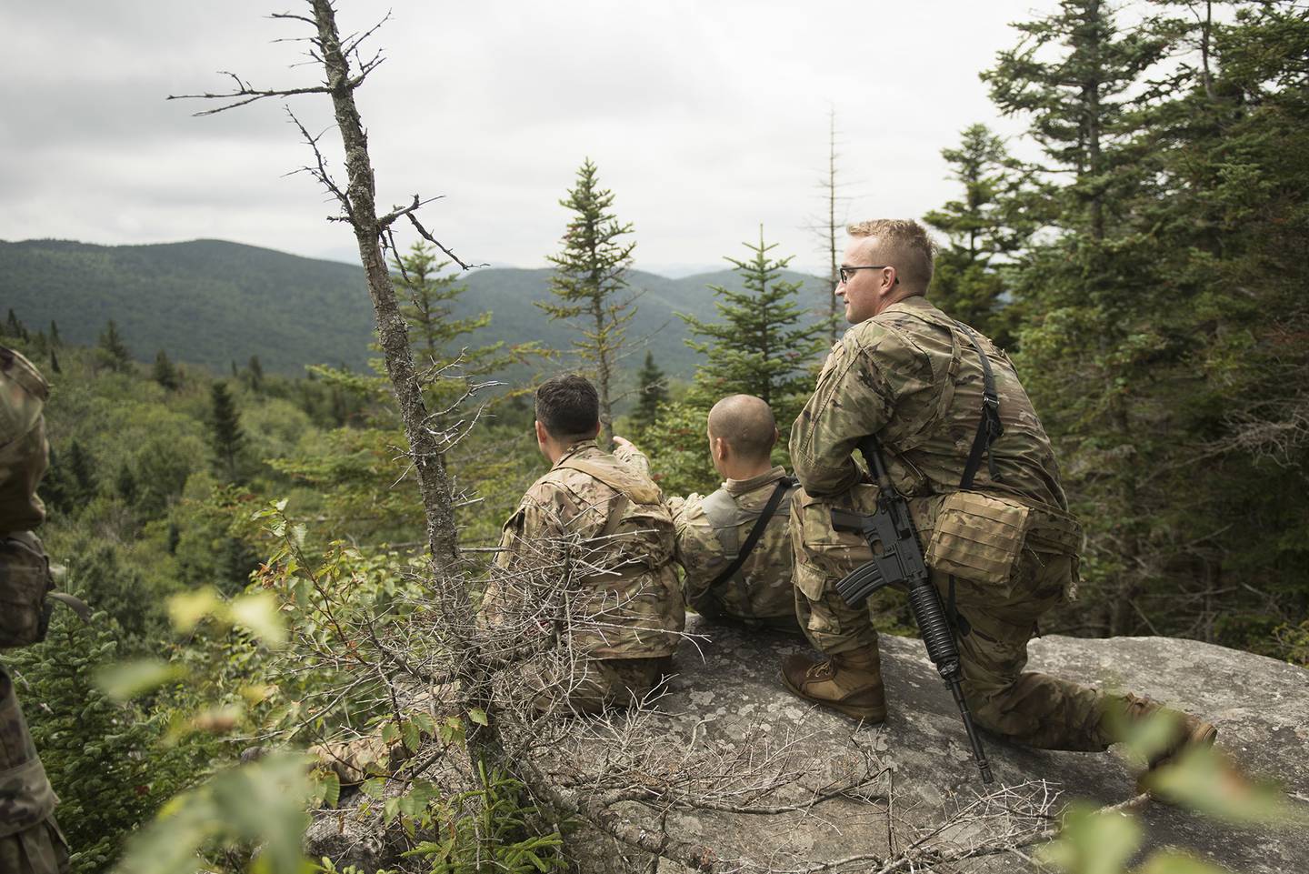 U.S. Army soldiers, Headquarters and Headquarters Battery, 2nd Battalion, 32nd Field Artillery Regiment, 101st Airborne Division, look for potential shooting positions during the Mountain Planners Course, Camp Ethan Allen Training Site, Jericho, Vt., Aug. 2, 2018.