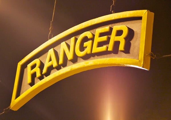 A U.S. Army Ranger tab hangs above the training area where the competitors for the Best Ranger Competition wait to begin at Camp Rogers, Fort Benning, Ga., on April 11, 2014. (Sgt. Austin Berner/Army) 