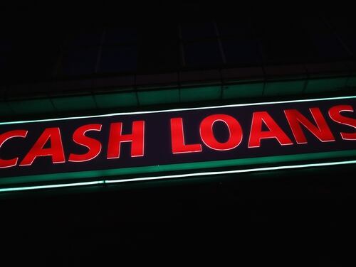 LONDON, ENGLAND - NOVEMBER 01: A general view of a 'Speedy Cash' cash loans shop on Brixton High Street on November 1, 2012 in London, England. The recession has changed the face of the UK's high streets, which have seen a boom in bookmakers, discount stores, charity shops, cheque cashing (payday loans) and pawnbrokers as cash-strapped Brits struggled with their finances. (Photo by Dan Kitwood/Getty Images)