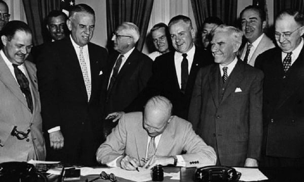 President Dwight Eisenhower signs HR 7786, June 1, 1954, which changed Armistice Day to Veterans Day. (Eisenhower Presidential Library and Museum)