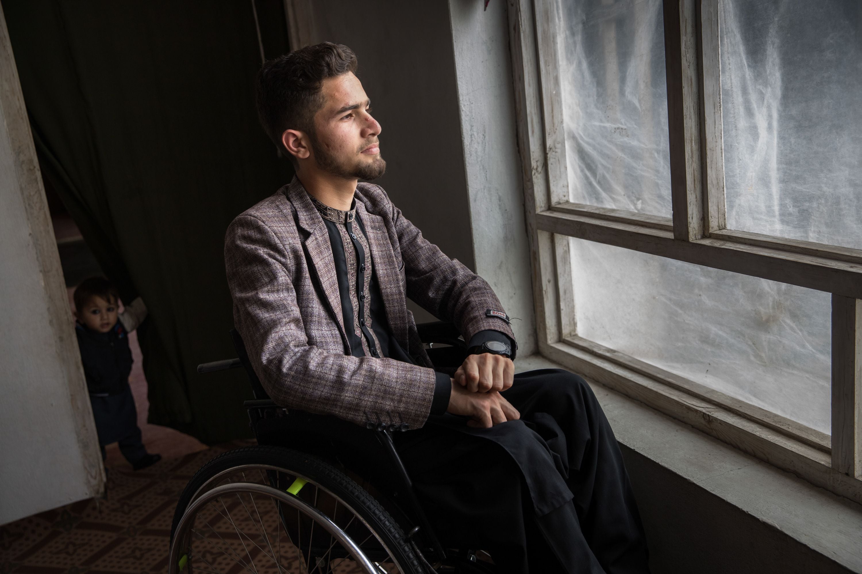 Shabir Ahmad Mohammadi at home in Jalalabad, Afghanistan, on March 11. He was partially paralyzed from the waist down. (Oriane Zerah for ProPublica)