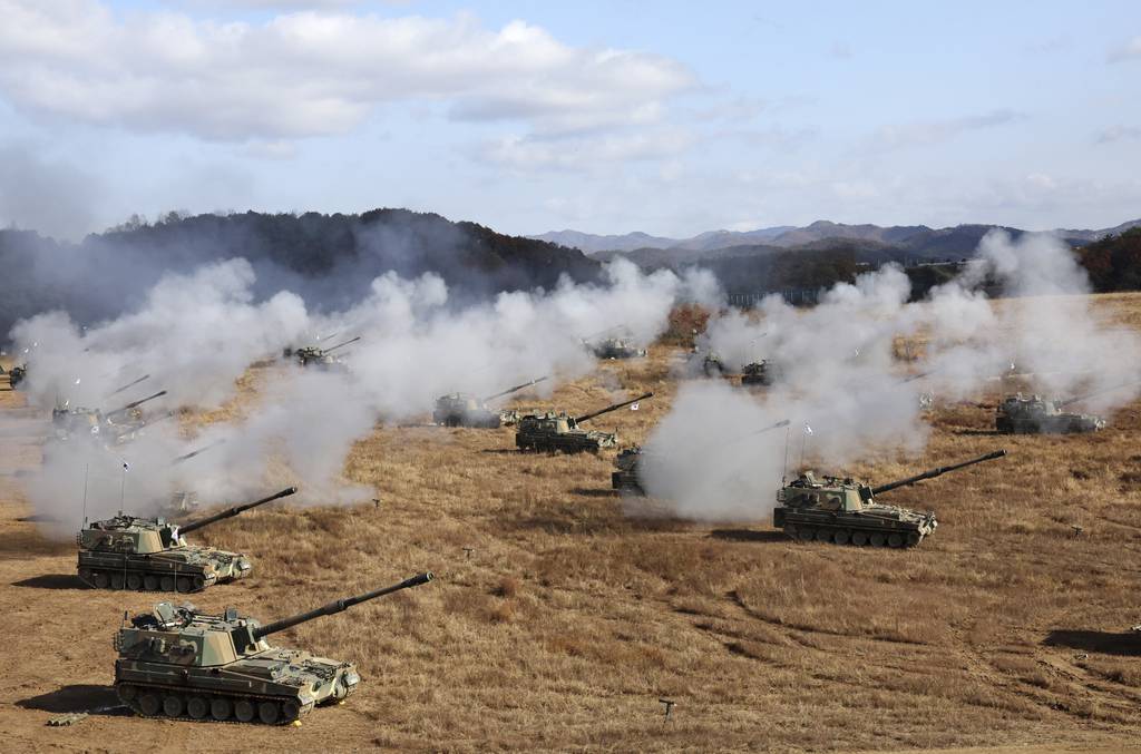 South Korean army K-9 self-propelled howitzers and K-55A1 self-propelled howitzers fire during the military drills at a training field in Cheorwon, South Korea, Friday, Oct. 27, 2023.