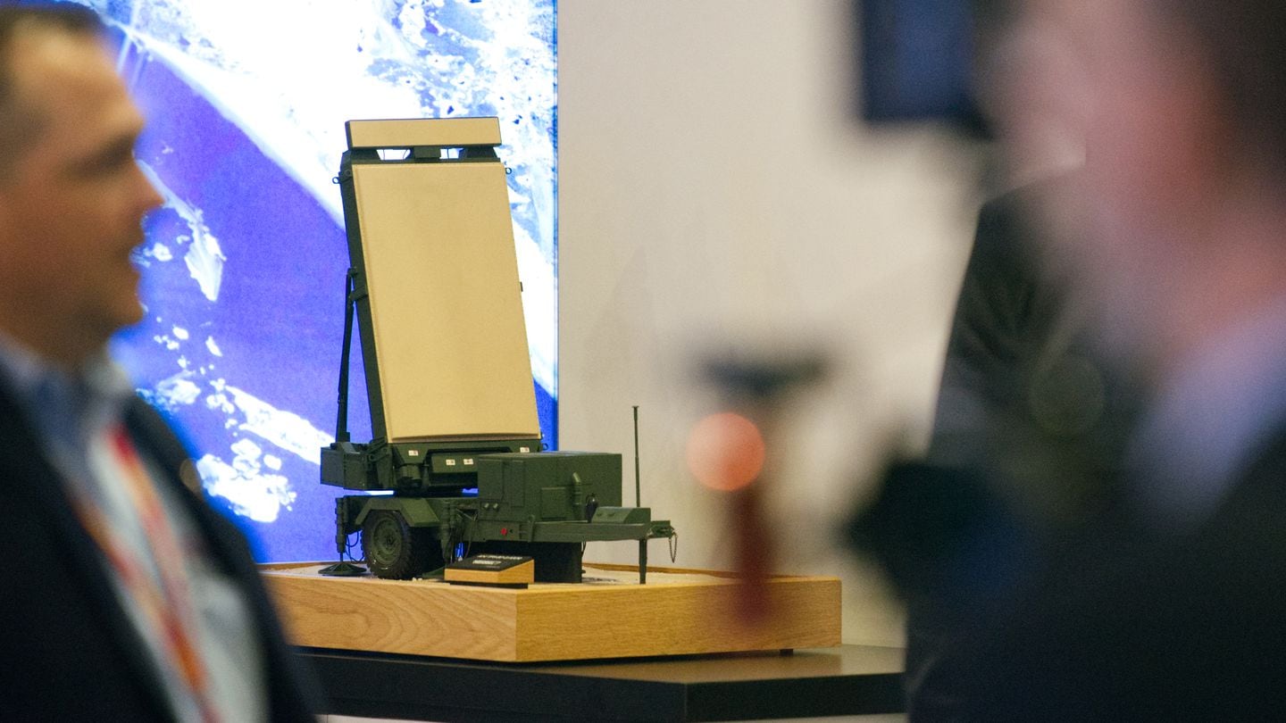 A model of Northrop Grumman's Ground/Air Task-Oriented Radar stands at the company's booth at the 2024 Sea-Air-Space defense conference. The G/ATOR setup is used by Marines. (Colin Demarest/C4ISRNET)
