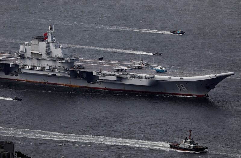 The Liaoning, China's first aircraft carrier, sails into Hong Kong for a 2017 port call to celebrate the 20th anniversary of the People's Liberation Army garrison's presence in the semi-autonomous Chinese city and former British colony. (Vincent Yu/AP)