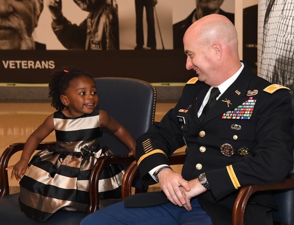 Chiara Jason, 2, smiles at her dad, Mike Jason, who retired May 23 as an Army colonel in a Pentagon ceremony.