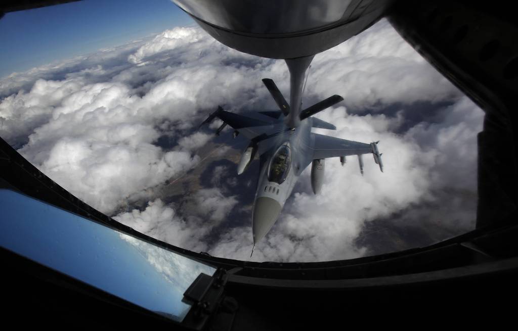 FILE - A U.S. Air Force F-16 refuels in mid-flight from a KC-135 Stratotanker during a Red Flag exercise over The Nevada Test and Training Range on Feb. 10, 2014.
