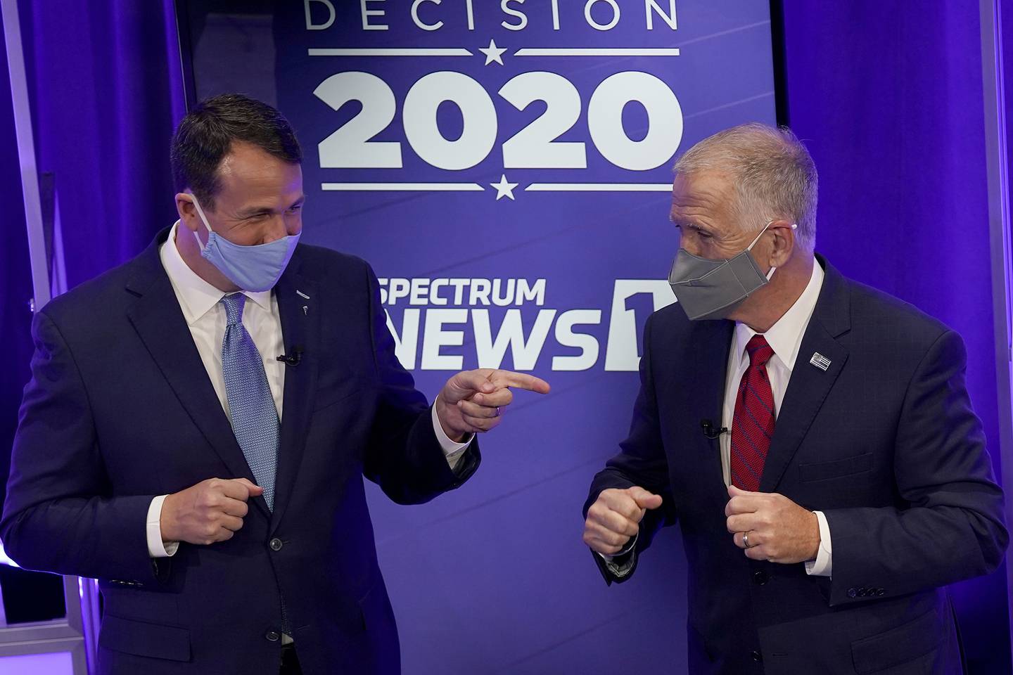 Democratic challenger Cal Cunningham, left, and U.S. Sen. Thom Tillis, R-N.C. greet each other after a televised debate Oct. 1, 2020, in Raleigh, N.C.